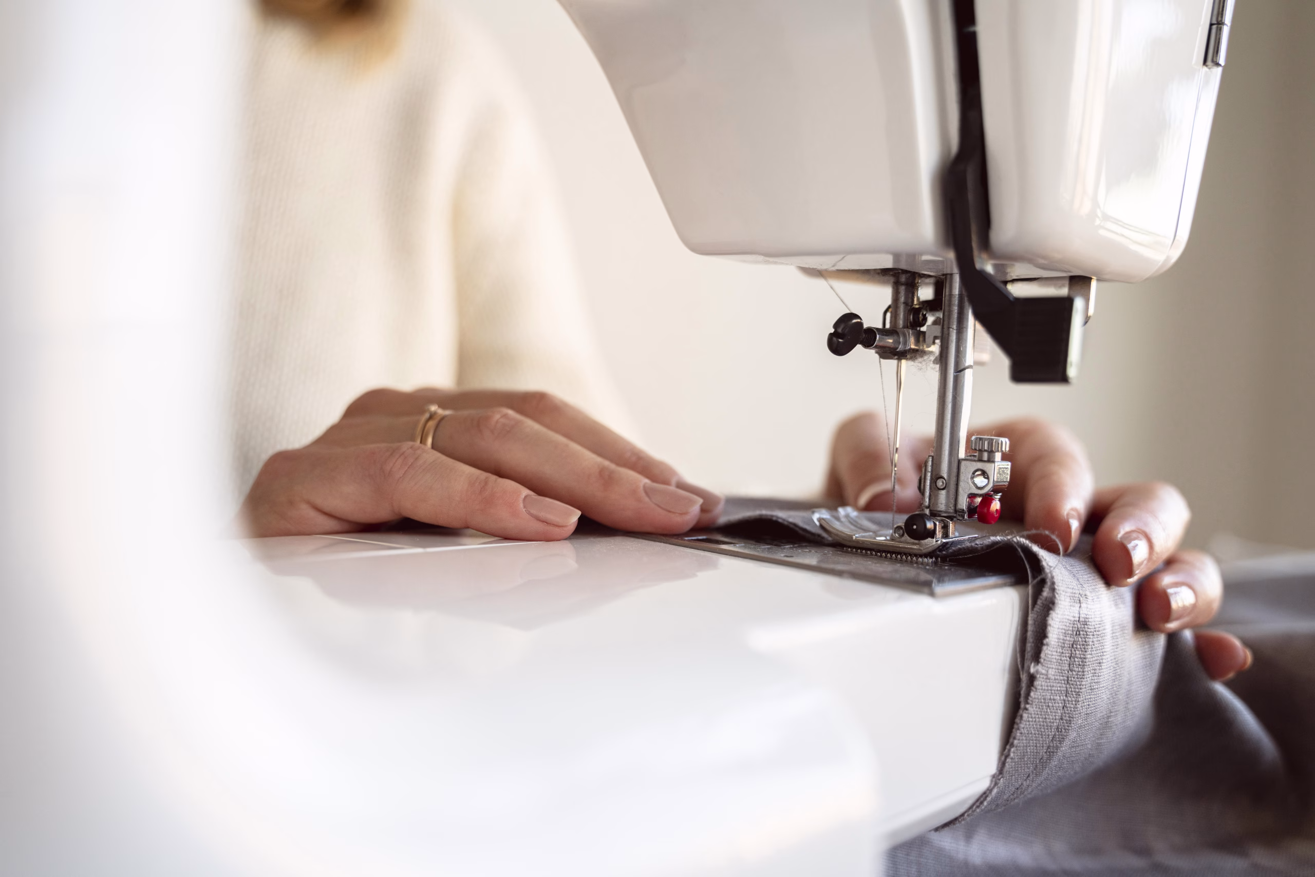 Close-up of careful work at a sewing machine